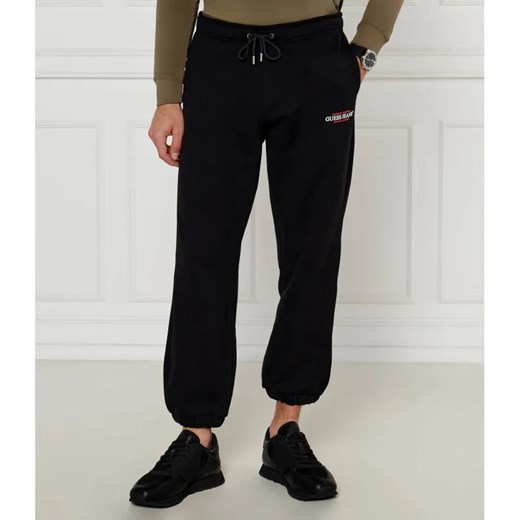 Guess Jeans Spodnie dresowe | Regular Fit ze sklepu Gomez Fashion Store w kategorii Spodnie męskie - zdjęcie 187041288