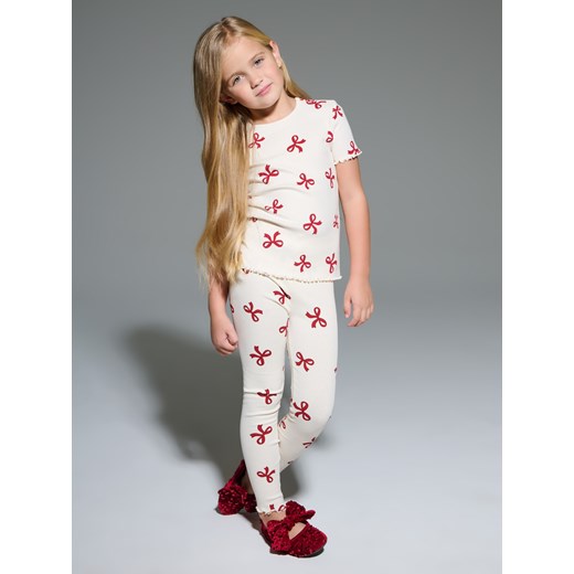 Sinsay - Bawełniana koszulka ze wzorem w kokardy - kremowy Sinsay 116 (5-6 l) Sinsay