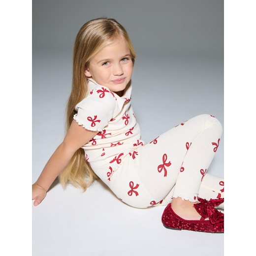 Sinsay - Bawełniana koszulka ze wzorem w kokardy - kremowy Sinsay 128 (7-8 l) Sinsay