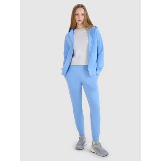 Damskie spodnie dresowe joggery 4F 4FWMM00TTROF1386 - niebieskie ze sklepu Sportstylestory.com w kategorii Spodnie damskie - zdjęcie 187242926