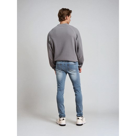 Sinsay - Spodnie jeansowe super skinny - niebieski Sinsay 36 Sinsay