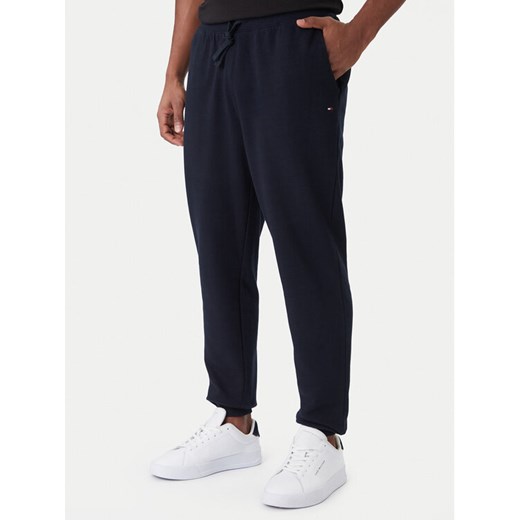 Tommy Hilfiger Spodnie dresowe Terry MW0MW37236 Granatowy Regular Fit ze sklepu MODIVO w kategorii Spodnie męskie - zdjęcie 187259986