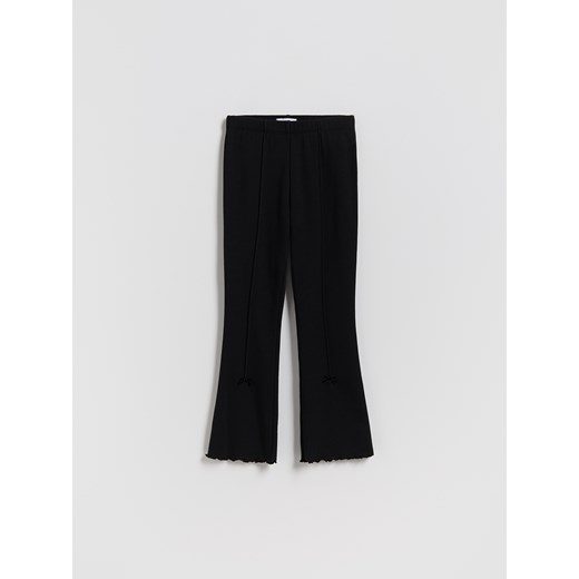 Reserved - Ocieplane legginsy flare z kokardkami - czarny ze sklepu Reserved w kategorii Spodnie dziewczęce - zdjęcie 187278469