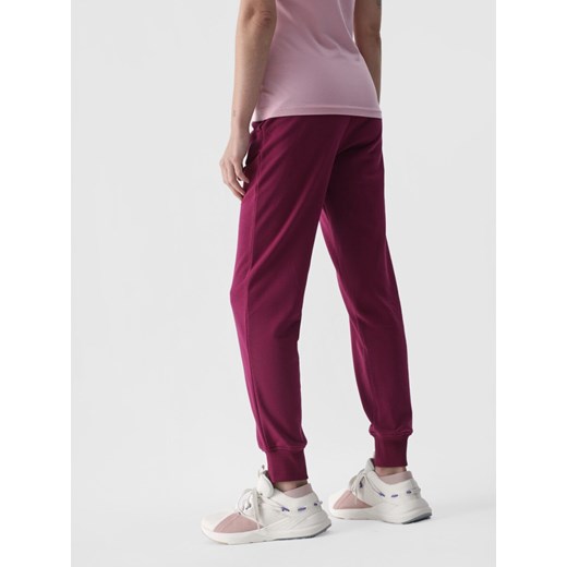 Damskie spodnie dresowe joggery 4F 4FWMM00TTROF0945 - różowe XS Sportstylestory.com okazja