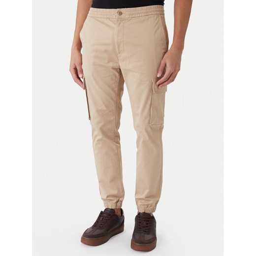 Calvin Klein Jeans Joggery Comfort LV04RD608G Brązowy Skinny Fit - id: 0000305567031 - marki Calvin Klein - 187319827 Calvin Klein Jeans Joggery Comfort LV04RD608G Brązowy Skinny Fit ze sklepu MODIVO w kategorii Spodnie męskie - zdjęcie 187319827