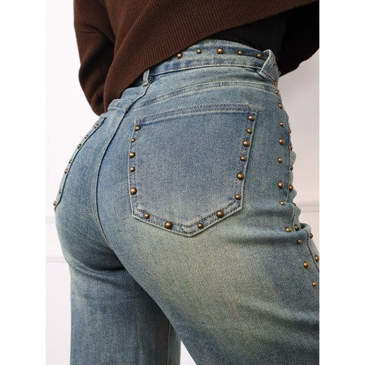 SPODNIE JEANSOWE Z SZEROKIMI NOGAWKAMI I OZDOBNYMI DŻETAMI- GRANATOWE ze sklepu olika.com.pl w kategorii Jeansy damskie - zdjęcie 187320816