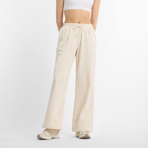 Spodnie damskie New Balance WP51503LIN – beżowe ze sklepu New Balance Poland w kategorii Spodnie damskie - zdjęcie 187331139