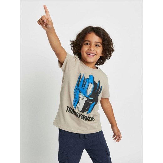 Sinsay - Bawełniana koszulka z nadrukiem Transformers - kremowy ze sklepu Sinsay w kategorii T-shirty chłopięce - zdjęcie 187333258
