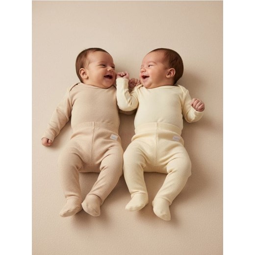 Sinsay - Prążkowane spodnie z zakrytymi stopami 2 pack - kremowy ze sklepu Sinsay w kategorii Spodnie i półśpiochy - zdjęcie 187513418