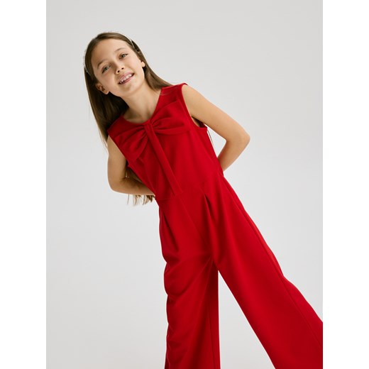 Reserved - Kombinezon z kokardą - czerwony ze sklepu Reserved w kategorii Kombinezony dziewczęce - zdjęcie 187545797