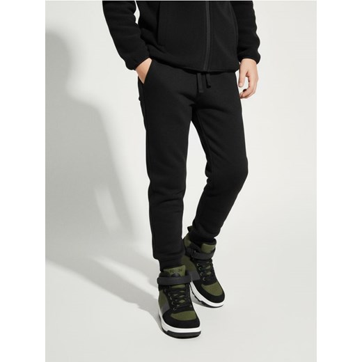 Sinsay - Ocieplane spodnie jogger - czarny ze sklepu Sinsay w kategorii Spodnie dziewczęce - zdjęcie 187559427