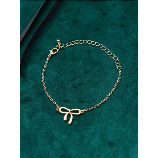 Sinsay - Bransoletka z zawieszką w kształcie kokardy - złoty ze sklepu Sinsay w kategorii Bransoletki - zdjęcie 187576836