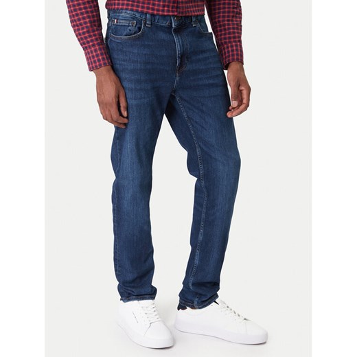 Tommy Hilfiger Jeansy Bleecker MW0MW41905 Niebieski Slim Fit ze sklepu MODIVO w kategorii Jeansy męskie - zdjęcie 187598518
