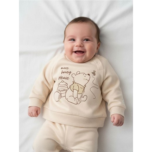 Sinsay - Bawełniana bluza z nadrukiem Winnie the Pooh - beżowy ze sklepu Sinsay w kategorii Odzież dla niemowląt - zdjęcie 187615547