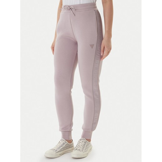 Guess Spodnie dresowe Allie Scuba V2YB18 K7UW2 Beżowy Regular Fit ze sklepu MODIVO w kategorii Spodnie damskie - zdjęcie 187625216