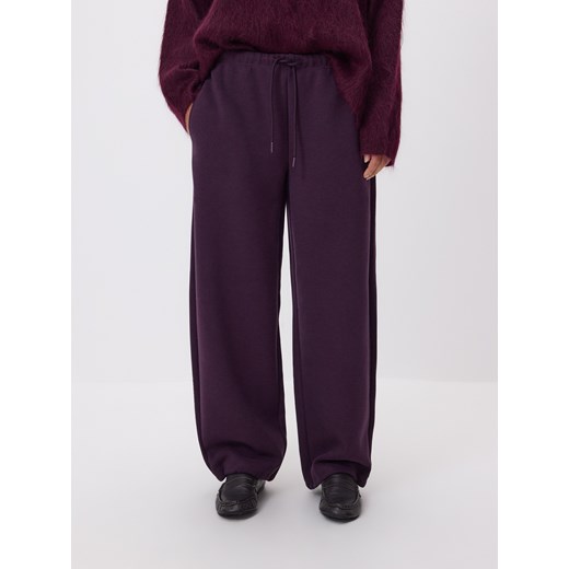 Reserved - Spodnie z dodatkiem wiskozy - ciemnofioletowy ze sklepu Reserved w kategorii Spodnie damskie - zdjęcie 187669627