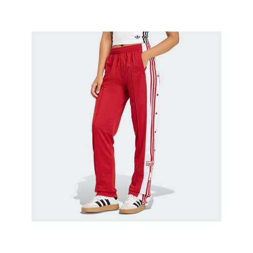 adidas Spodnie dresowe Adibreak KD6324 Czerwony Loose Fit ze sklepu MODIVO w kategorii Spodnie damskie - zdjęcie 187696258