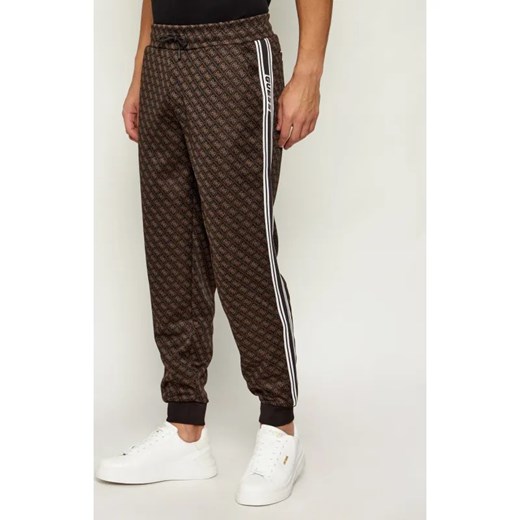 GUESS ACTIVE Spodnie dresowe PARIMO | Regular Fit ze sklepu Gomez Fashion Store w kategorii Spodnie męskie - zdjęcie 187747638