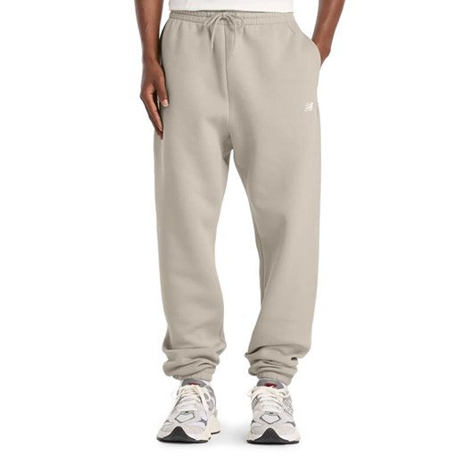 Spodnie męskie New Balance MP41503TWF - beżowe ze sklepu streetstyle24.pl w kategorii Spodnie męskie - zdjęcie 187781979
