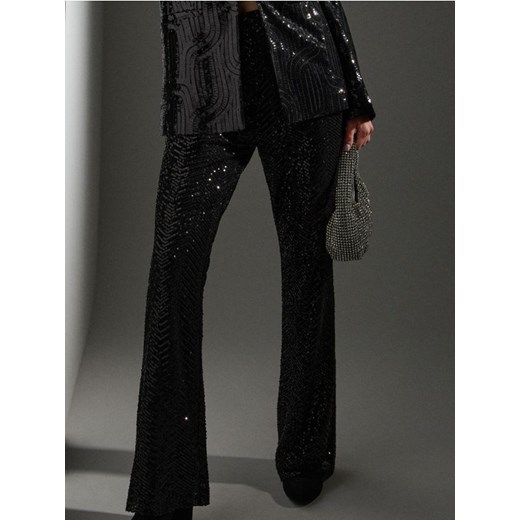 Sinsay - Spodnie dzwony z połyskującymi cekinami - czarny ze sklepu Sinsay w kategorii Spodnie damskie - zdjęcie 187799736