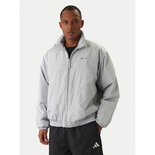 adidas Kurtka przejściowa Moon Boot JM8923 Szary Loose Fit ze sklepu MODIVO w kategorii Kurtki męskie - zdjęcie 187828197