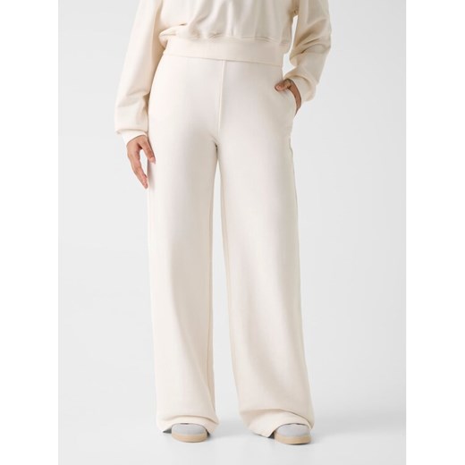 Guess Spodnie materiałowe 180561 Biały Slim Fit ze sklepu MODIVO w kategorii Spodnie damskie - zdjęcie 187924668