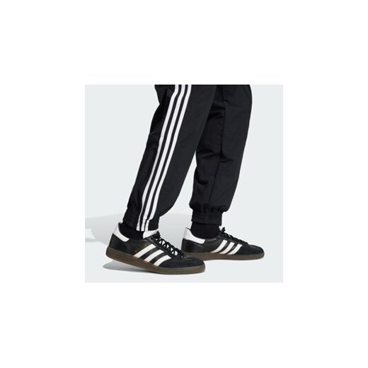 adidas Spodnie dresowe Firebird Woven KE1371 Czarny Regular Fit XL MODIVO