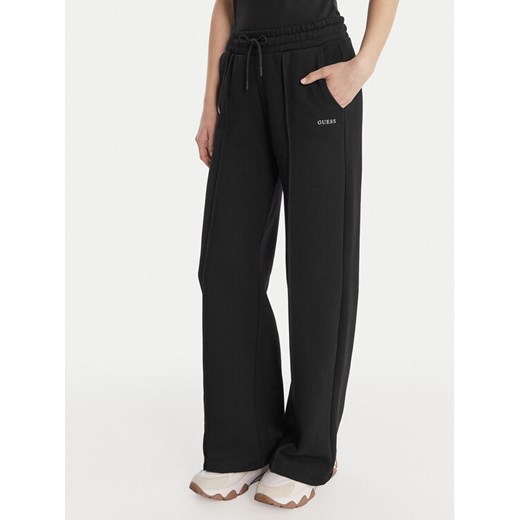 Guess Spodnie dresowe V6RB17 K9V31 Czarny Regular Fit ze sklepu MODIVO w kategorii Spodnie damskie - zdjęcie 187962685