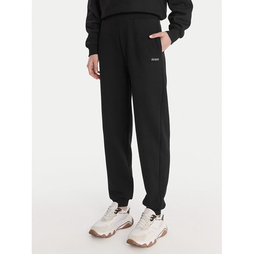 Guess Spodnie dresowe V6RB15 K9V31 Czarny Regular Fit ze sklepu MODIVO w kategorii Spodnie damskie - zdjęcie 187964428
