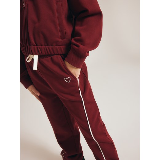 Reserved - Spodnie dresowe z przeszyciami - bordowy ze sklepu Reserved w kategorii Spodnie i półśpiochy - zdjęcie 188001387