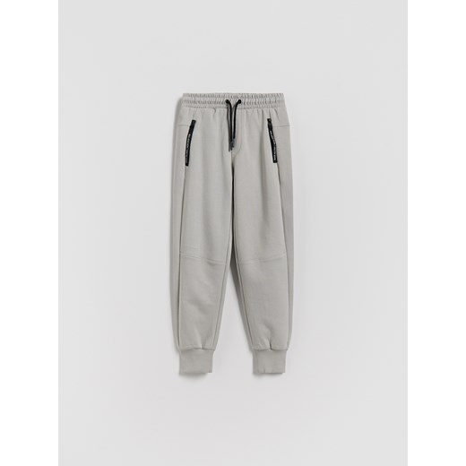 Reserved - Bawełniane spodnie jogger - jasnoszary ze sklepu Reserved w kategorii Spodnie chłopięce - zdjęcie 188067648