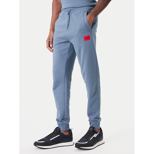 HUGO Spodnie dresowe Doak212 50447963 Granatowy Regular Fit ze sklepu MODIVO w kategorii Spodnie męskie - zdjęcie 188081328