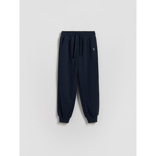 Reserved - Bawełniane spodnie jogger - granatowy ze sklepu Reserved w kategorii Spodnie chłopięce - zdjęcie 188083717