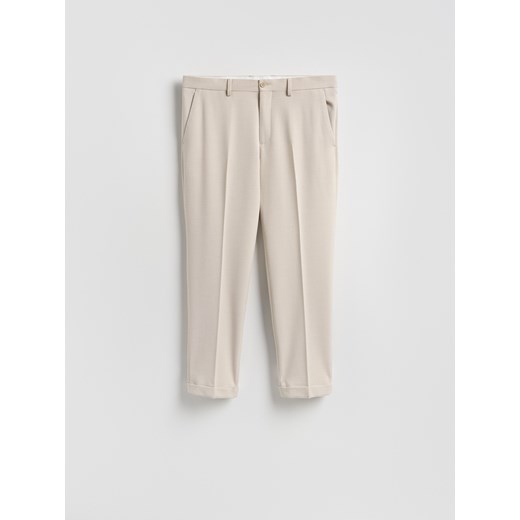 Reserved - Garniturowe spodnie w kant - beżowy Reserved 50 Reserved