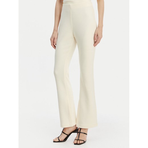 Calvin Klein Spodnie materiałowe LV044B223G Beżowy Flare Fit ze sklepu MODIVO w kategorii Spodnie damskie - zdjęcie 189387496