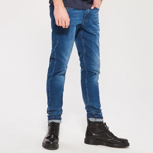 Reserved - Dopasowane jeansy z podartą nogawką - Niebieski granatowy Reserved 33/32 