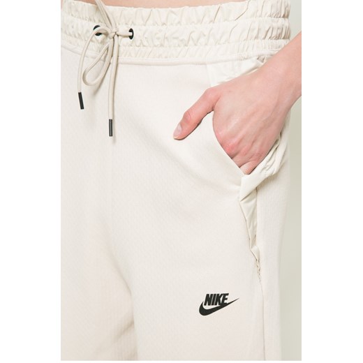 Spodnie sportowe beżowe Nike Sportswear 