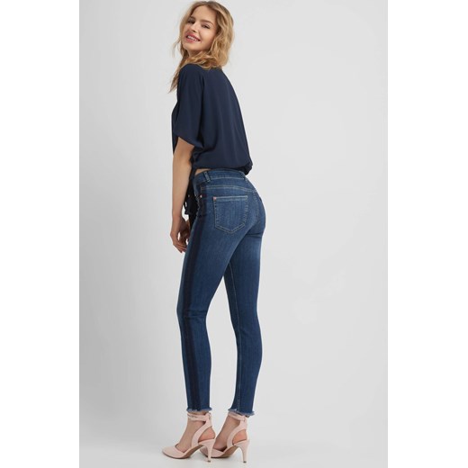 Skinny jeans z przetarciami ORSAY  40 orsay.com