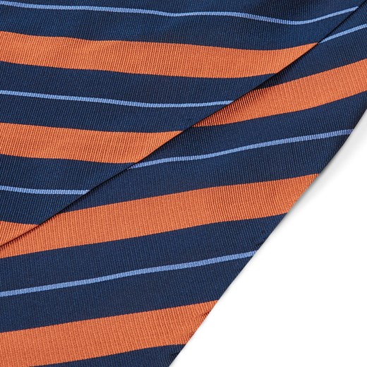 Ciemnogranatowy krawat jedwabny w pastelowe pomarańczowo-niebieskie paski