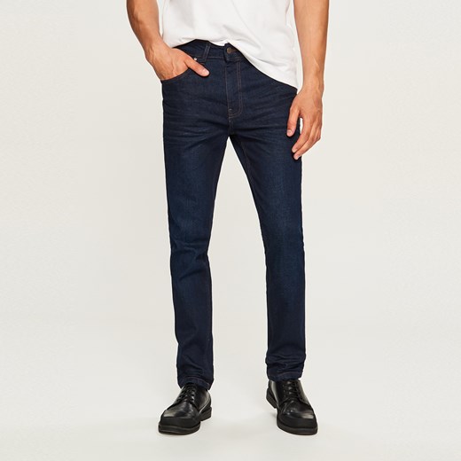 Reserved - Spodnie jeansowe slim fit z przetarciami - Niebieski
