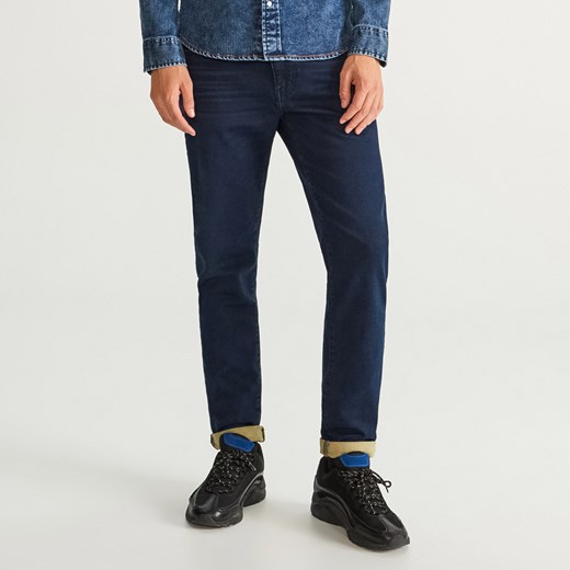 Granatowe jeansy męskie Reserved 