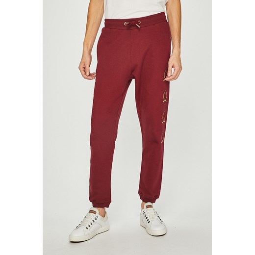 Czerwone spodnie męskie Tommy Jeans sportowe 