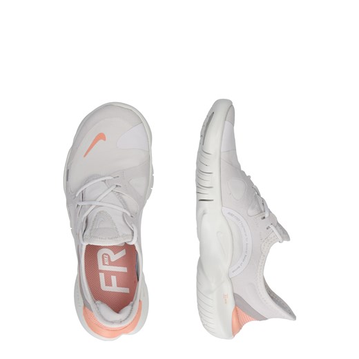 Buty sportowe damskie Nike do biegania białe sznurowane bez wzorów płaskie 