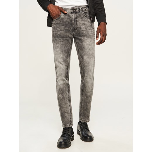 Reserved - Spodnie jeansowe slim fit z przetarciami - Szary