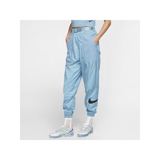 Damskie spodnie z tkaniny z logo Swoosh Nike Sportswear - Niebieski