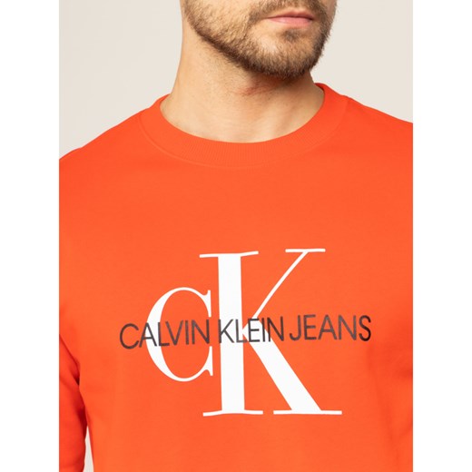 Bluza męska pomarańczowy Calvin Klein z napisami młodzieżowa 