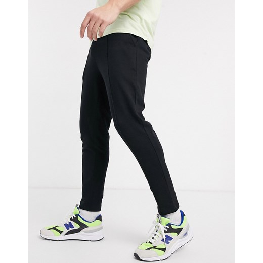 ASOS DESIGN – Czarne zwężane joggersy z zakładkami z bawełny organicznej-Czarny