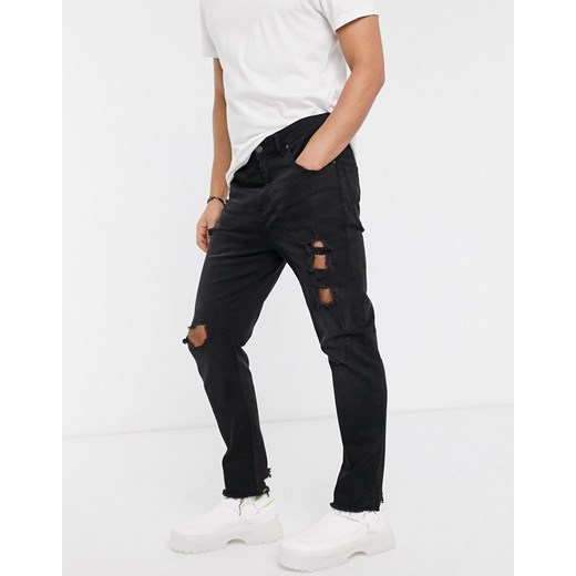 ASOS DESIGN – Czarne jeansy o marchewkowym kroju ze zwężanymi nogawkami, efektem sprania i mocnymi przedarciami-Czarny W28 L30 Asos Poland