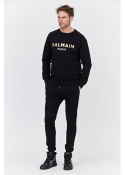 BALMAIN - Czarne męskie spodnie dresowe z aksamitnym logo ze sklepu outfit.pl w kategorii Spodnie męskie - zdjęcie 126366076