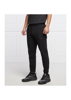 GUESS JEANS Spodnie dresowe ADAM | Slim Fit ze sklepu Gomez Fashion Store w kategorii Spodnie męskie - zdjęcie 128081406